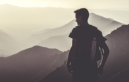 A man looking over the mountains