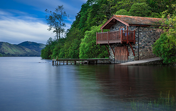 A stone house beside open water